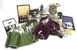 A collection of silver plate to include an engraved baluster shaped ice bucket with a swing handle.