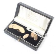 Two pairs of 9ct gold oval twin panel cufflinks.