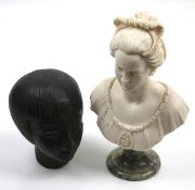 An alabaster bust of a young girl after Arnoldo Giannelli and a stone head of an Egyptian girl.