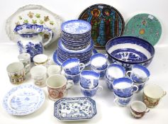 An assortment of blue and white china. Including Mason's jug and Willow pattern tea set, etc.