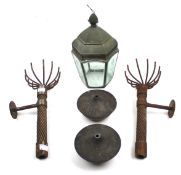 A pair of wall mounted oil lamps modelled as torches and a glass lantern.