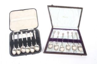 Two sets of six early 20th century silver coffee spoons.