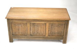 A reproduction oak blanket box.