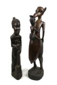 A pair of carved wooden tribal figures.