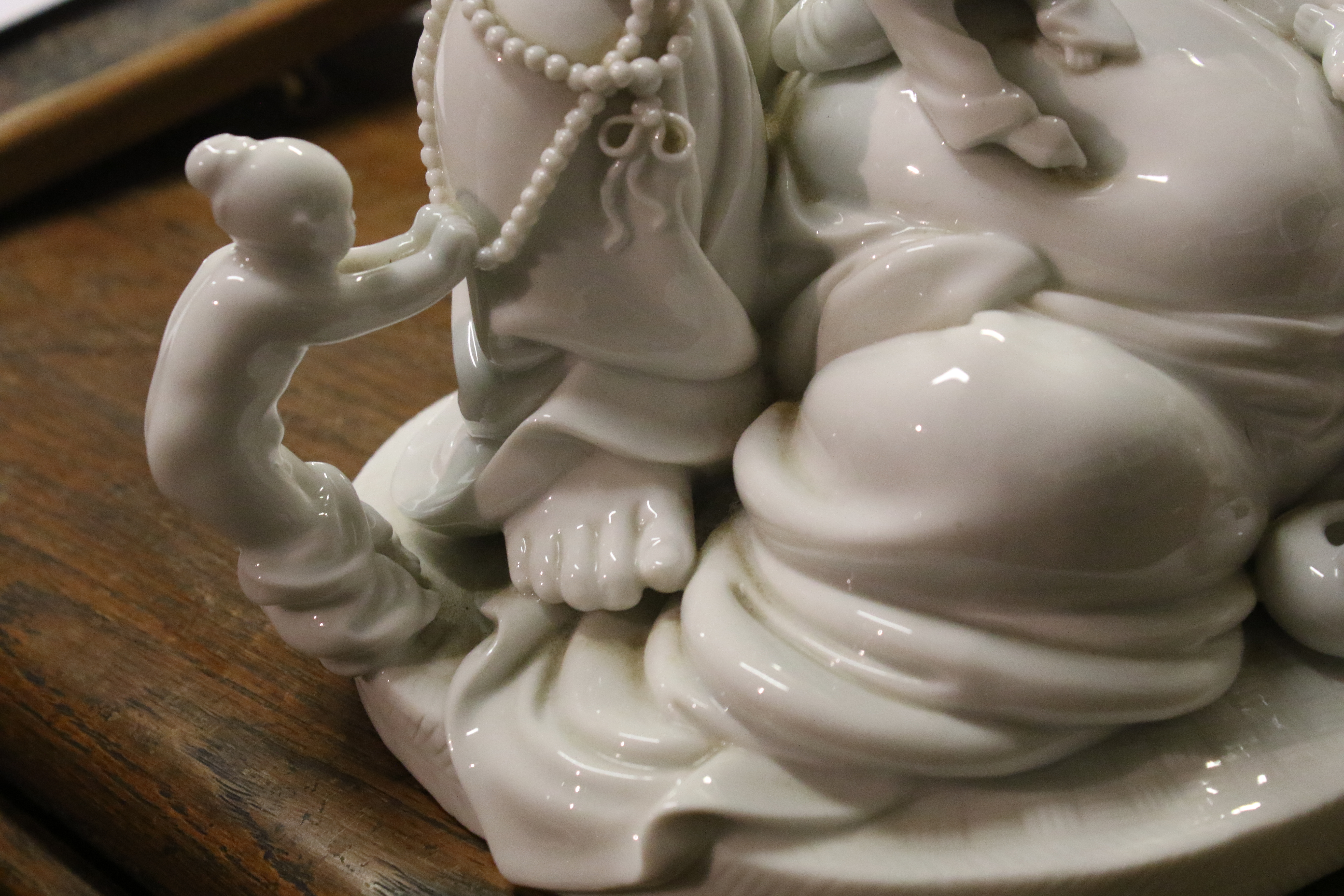 A 20th century Chinese Blanc de Chine figure of laughing Buddha with five children. - Image 8 of 17