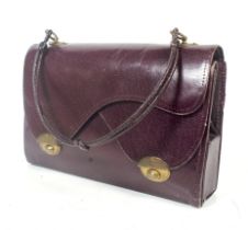 An early 20th century purple leather small hand bag.