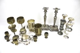 A collection of silver-plated items including a pair of candlesticks.