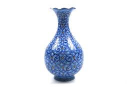 An Islamic enamel vase.