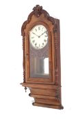 A late 19th century American eight-day walnut wall clock.