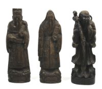 A collection of three assorted carved wood Chinese immortals figures. Max.
