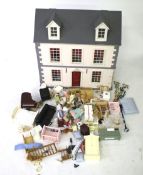 A dolls house and contents.