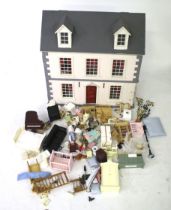 A dolls house and contents.