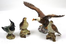 A collection of four vintage Beswick birds figures.