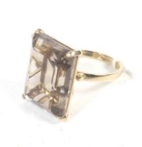 A vintage Italian gold and rectangular smokey quartz single stone ring.