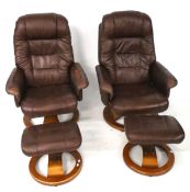 A pair of contemporary swivel chairs and footstools.