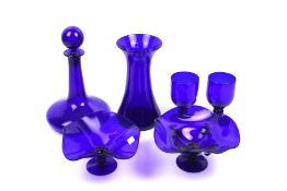 A collection of six assorted pieces of Bristol blue glass.
