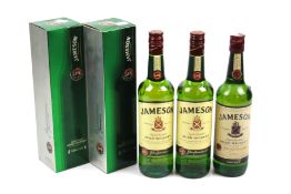 Three bottles of Jameson Irish Whiskey.