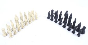 A set of resin black and white chess pieces modelled as Medieval figures. Max H9cm.