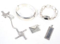 A collection of mostly British silver jewellery including a part foliate engraved hollow hinged