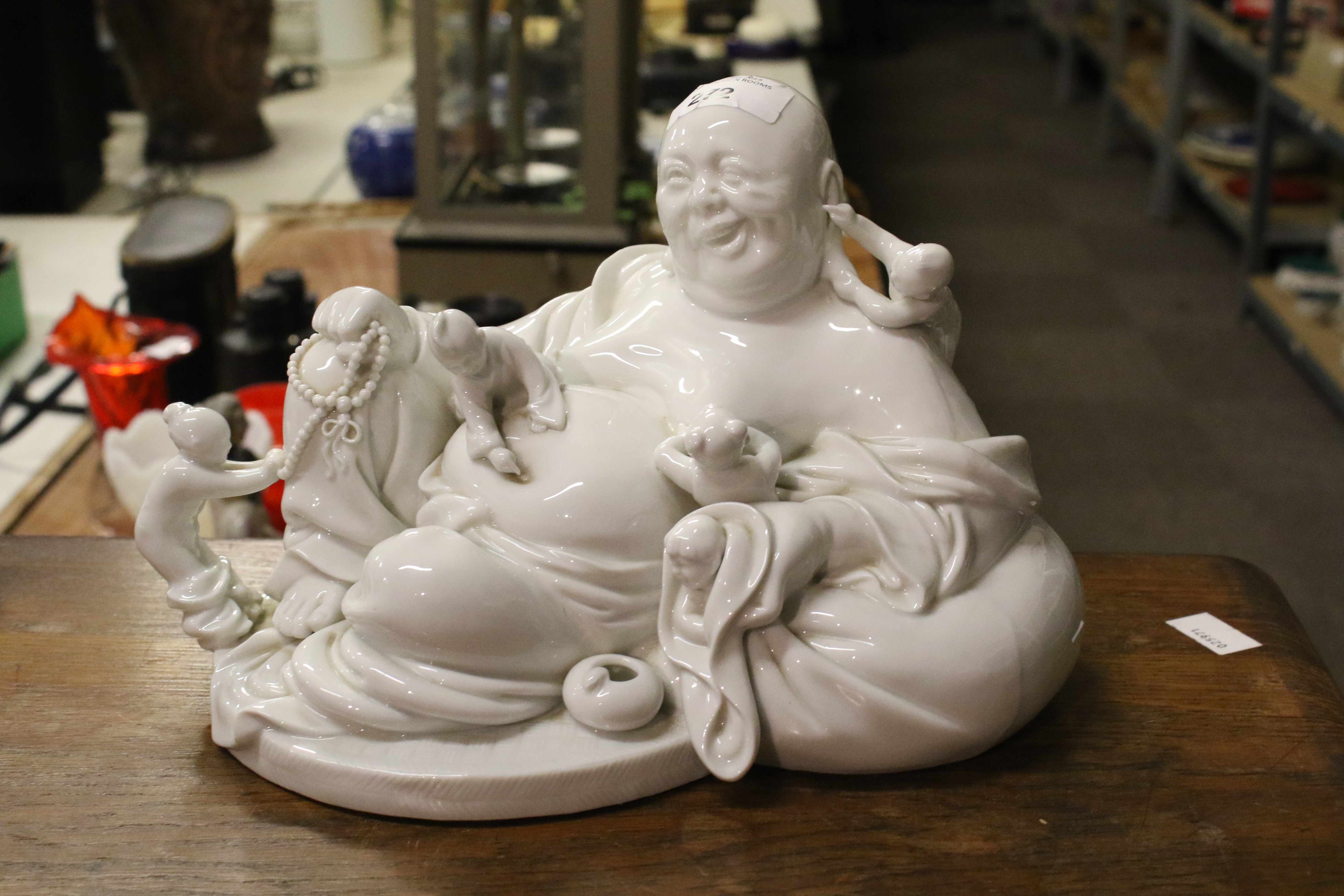 A 20th century Chinese Blanc de Chine figure of laughing Buddha with five children. - Image 3 of 17