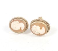 A pair of vintage 9ct gold and oval shell cameo stud earrings.