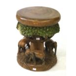 A carved wooden stool.