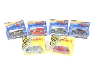 A collection of six Maisto diecast model cars. Including Aston Martin DB7 and Ferrari F40 etc.