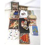 A collection of vintage jigsaws and card games. Including examples by Flacon, Gibson's, etc.