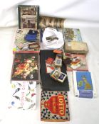 A collection of vintage jigsaws and card games. Including examples by Flacon, Gibson's, etc.