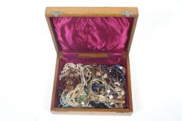 A vintage mahogany jewellery box enclosing a quantity of jewellery including watches, rings ,