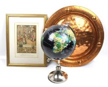 A globe, copper charger and a medieval print.