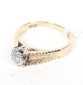 A vintage 9ct gold and diamond solitaire ring.