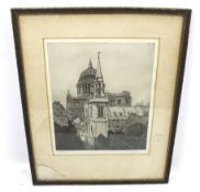 A signed etching of St Pauls Cathedral. Indistinct signature, 29.5cm x 24.