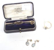 A small group of aquamarine jewellery including an aquamarine and small diamond three stone ring.