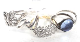 A collection of five lady's silver and yellow metal rings including a signet ring