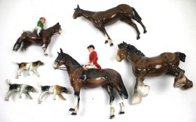 A collection of assorted china figures. Including two Beswick horses, etc. Max. H21cm (2x AF).