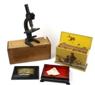 A cased vintage microscope and two boxes. Including a Russian black lacquered jewellery box, etc.