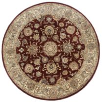 A 20th century circular Persian style rug.