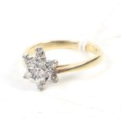A vintage diamond seven stone 'star' cluster ring.