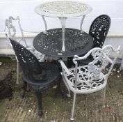 Two sets of cast metal garden tables and chairs. Painted black and the other silver. Max.