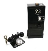 A vintage 'coin box' telephone.