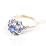 A vintage gold, blue and near colourless paste cluster dress ring. stamped '9ct', size J, 1.