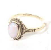 A vintage 9ct gold and opal single stone ring.