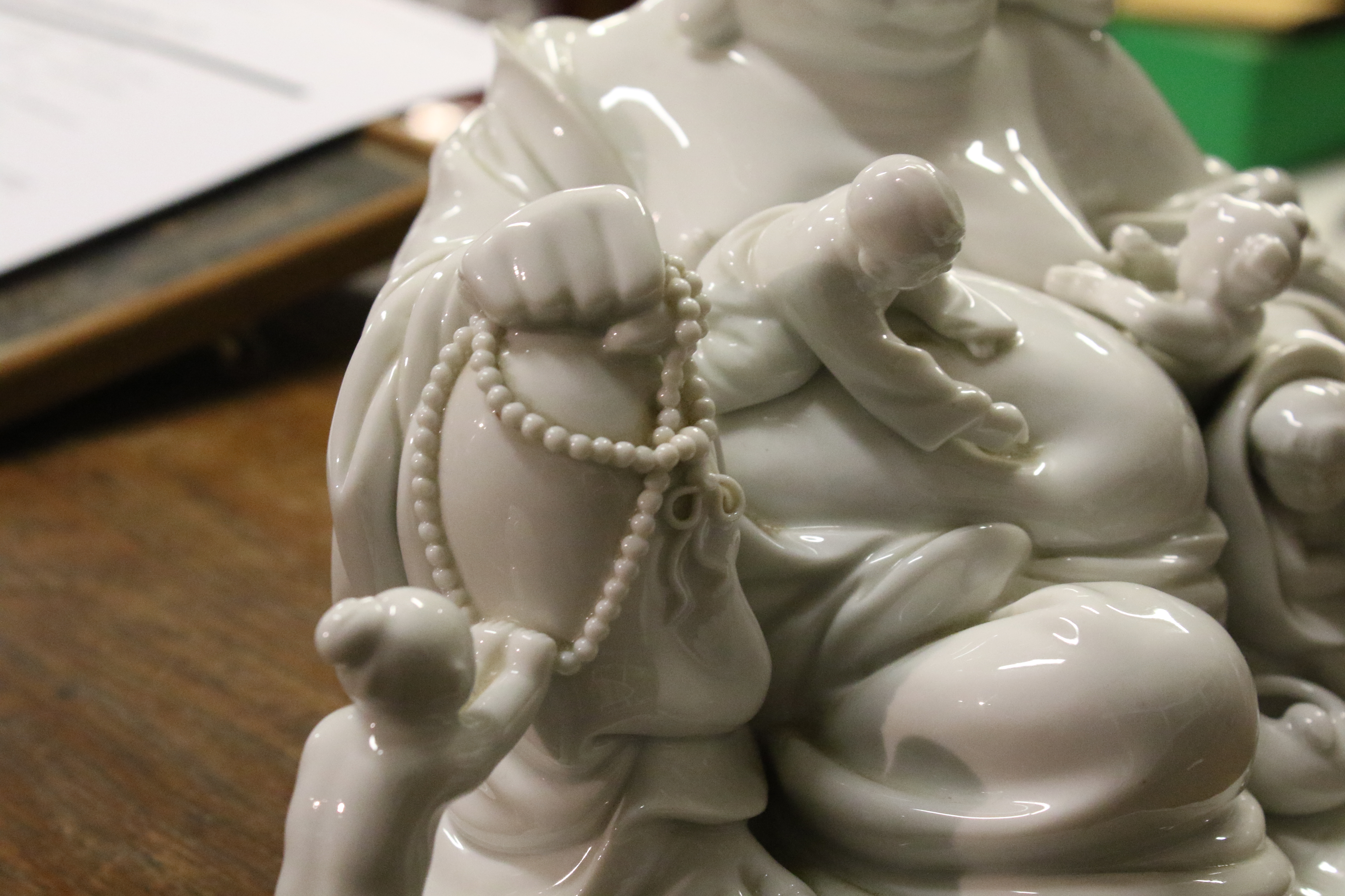 A 20th century Chinese Blanc de Chine figure of laughing Buddha with five children. - Image 7 of 17