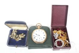 A small collection of jewellery and a pocket watch.