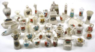 An assortment of Goss and crested ceramics. Including vases, ornaments, etc. Max.