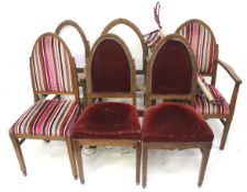 A set of six circa 1900 oak lancet shaped dining chairs.