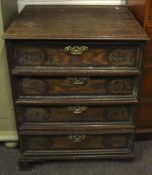 A vintage European style oak chest of drawers.