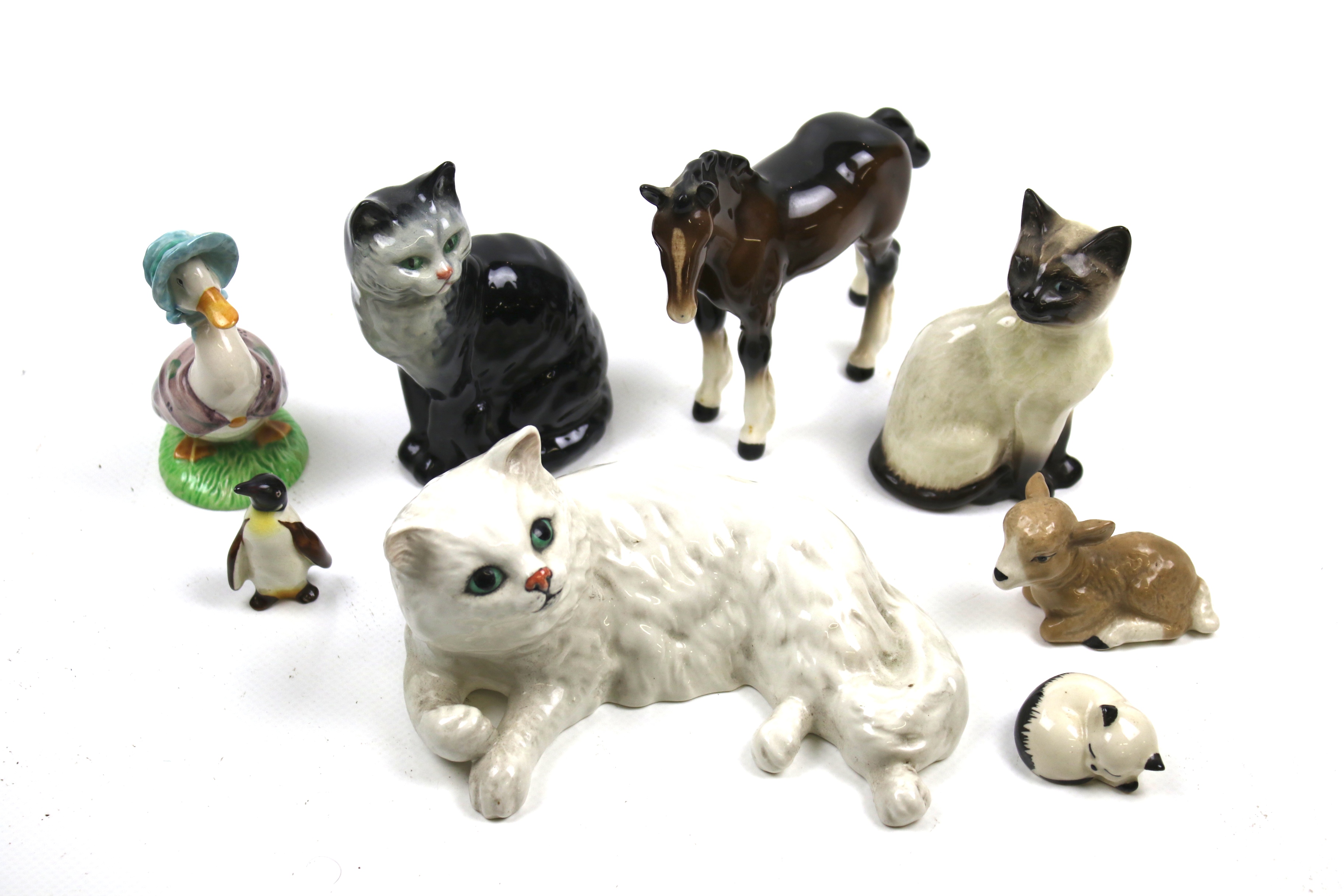 A collection of mid-century English ceramic animal figures.