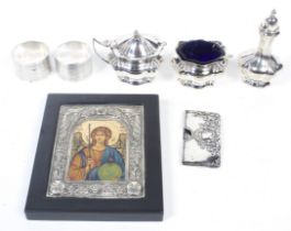 A small group of silver and other objects.